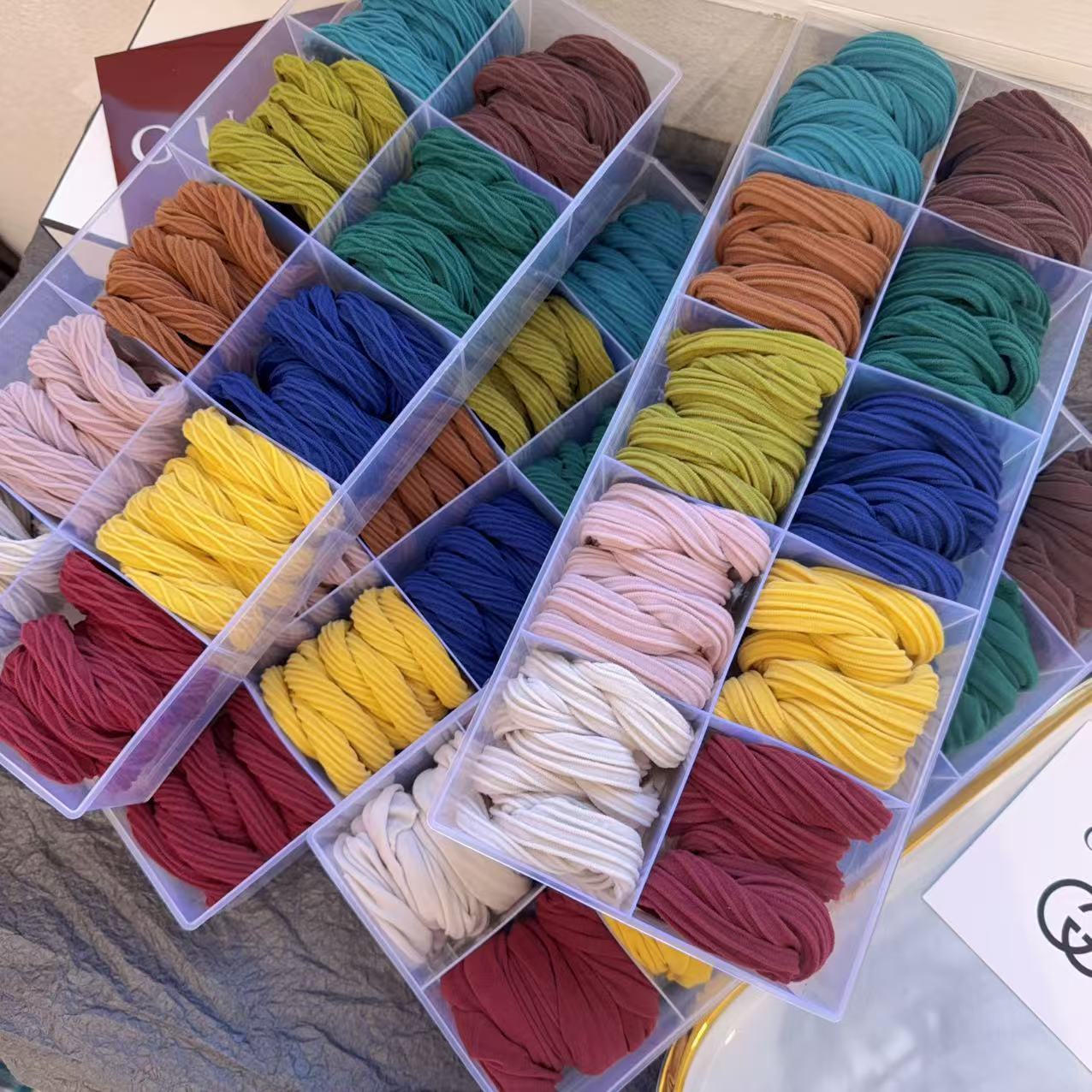 This is a real photo of a high-saturation, simple bow towel band for autumn and winter. The hair band is elastic and does not damage the hair. It is a fashionable and simple hair tie pic 2