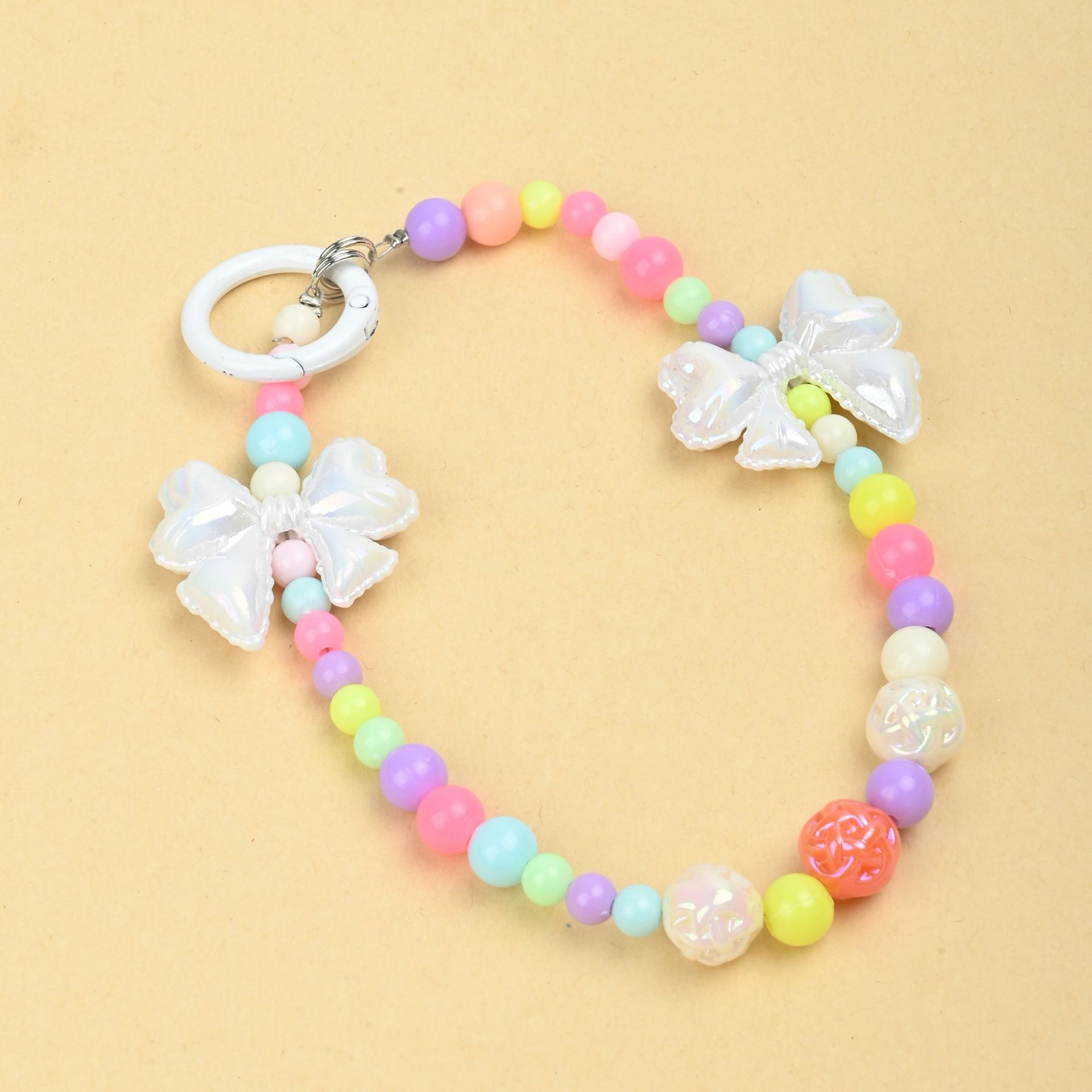 Wholesale of new colored candy-colored mobile phone chains, bows, beads, bag chains, water cup chains, car keychains and pendants pic 6