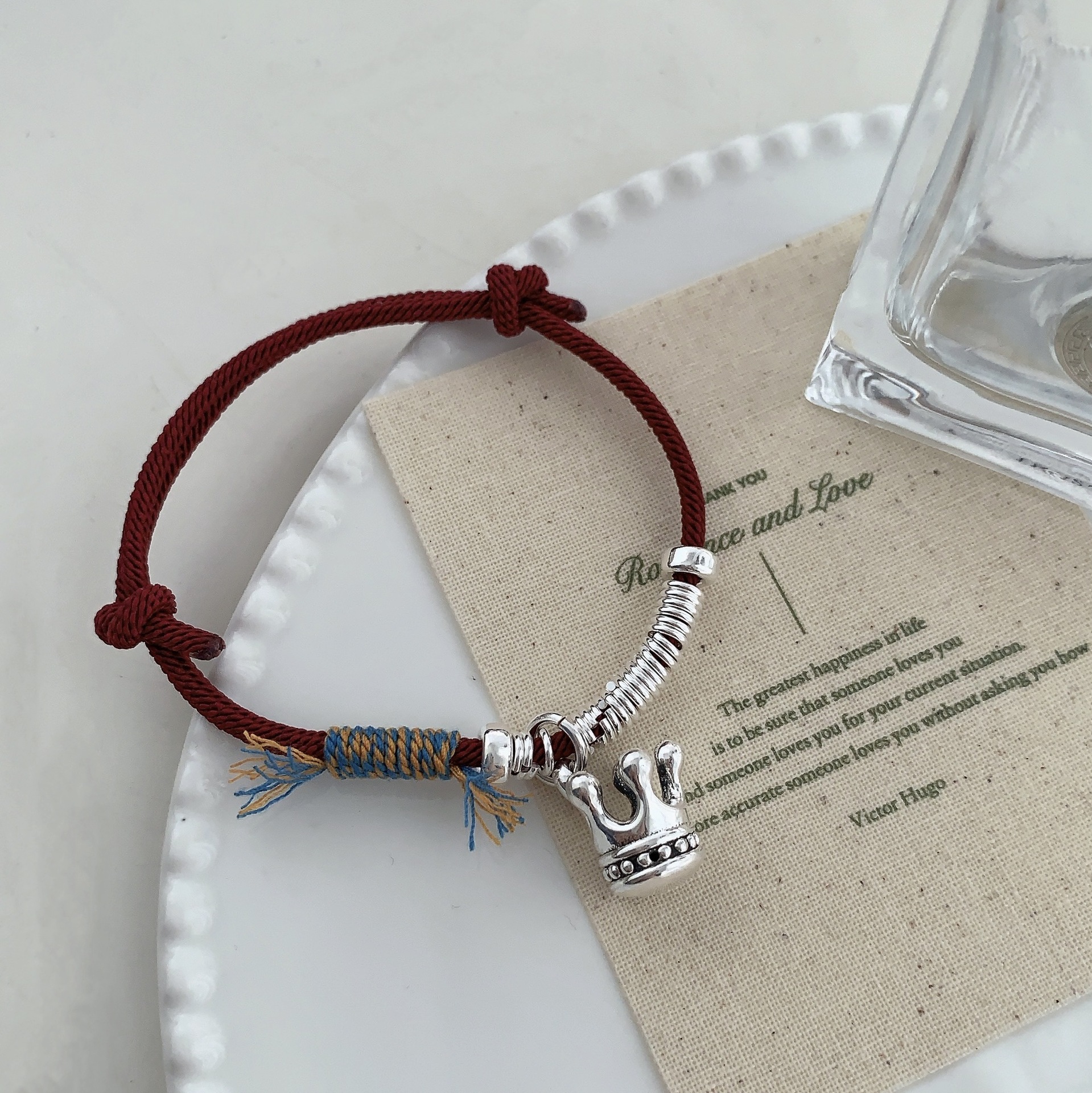 A unique and retro 12.12 crown coiled red string S925 sterling silver bracelet with a niche design, exuding a sense of light luxury and high-end fashion pic 3