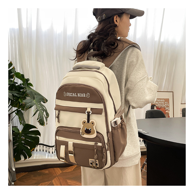 批发新款初高中学生大容量书包轻便减负背包小学生简约结实双肩包详情9