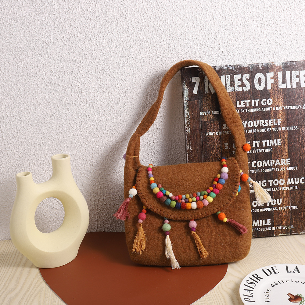 民族风羊毛毡挎包尼泊尔手工羊毛毡包包精致羊毛毡手拿包厂家直销详情3