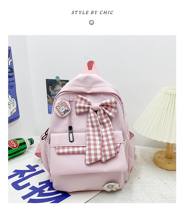 蝴蝶结书包女小学生大容量三到六年级初中轻便减负可爱简约双肩包详情18