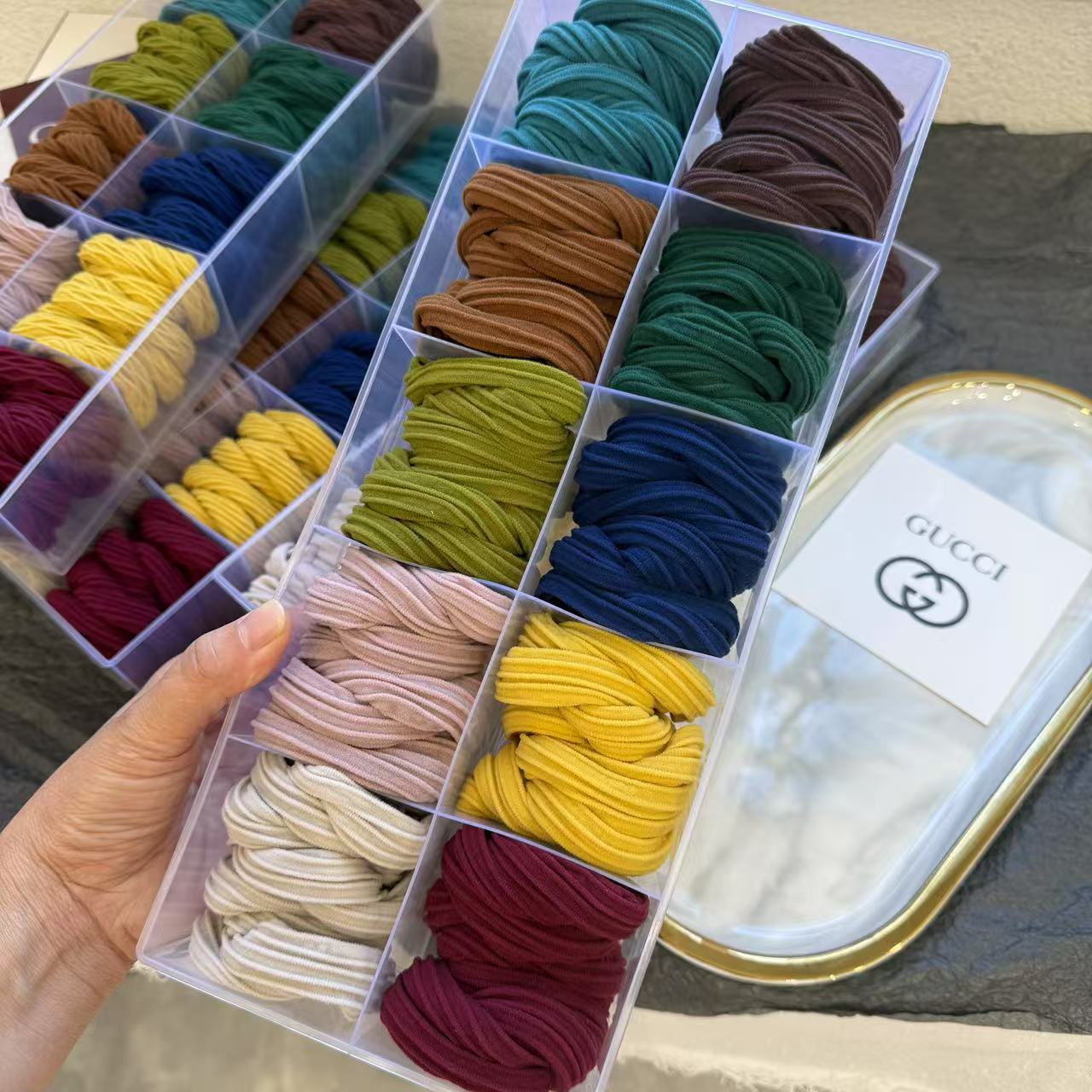 This is a real photo of a high-saturation, simple bow towel band for autumn and winter. The hair band is elastic and does not damage the hair. It is a fashionable and simple hair tie pic 3