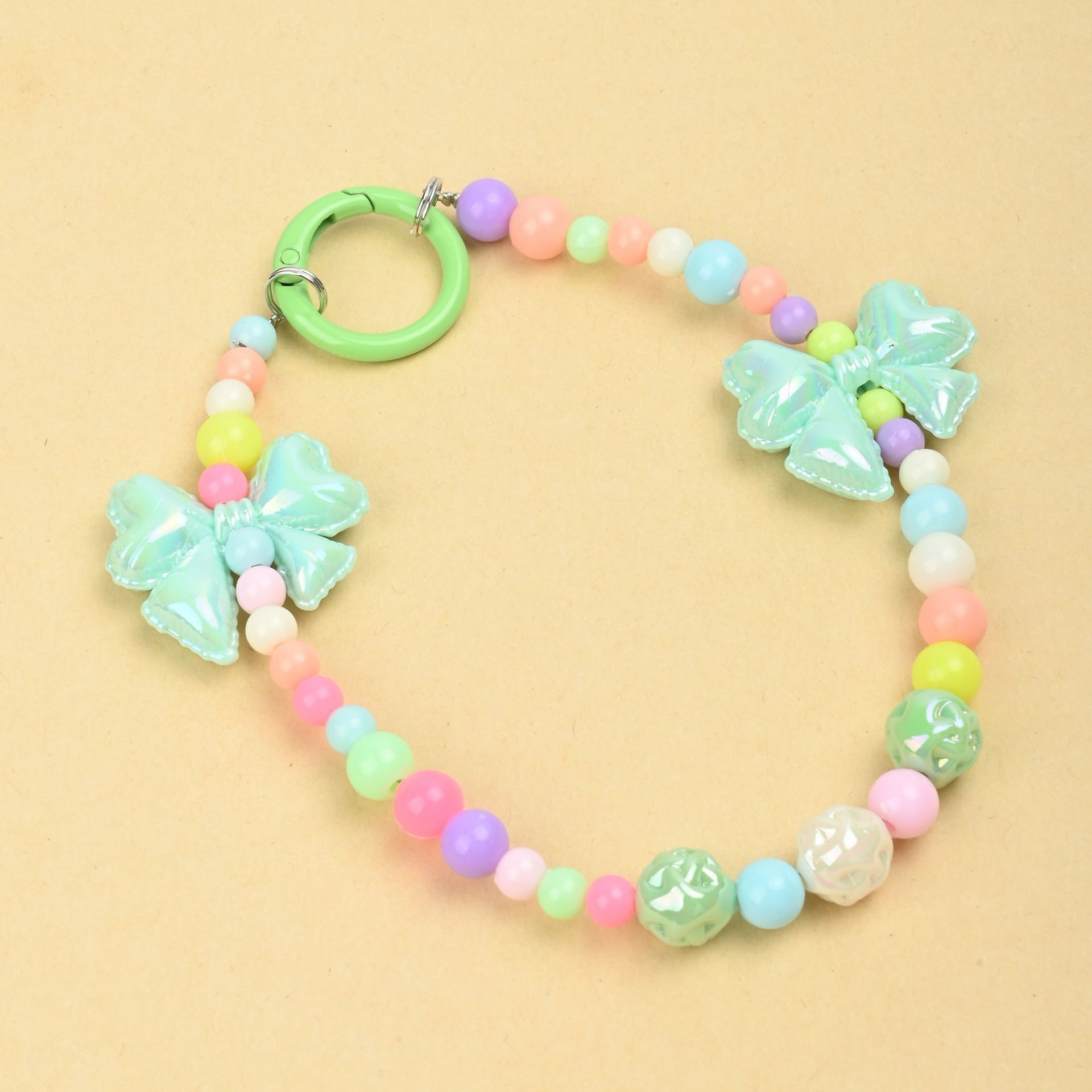 Wholesale of new colored candy-colored mobile phone chains, bows, beads, bag chains, water cup chains, car keychains and pendants pic 5