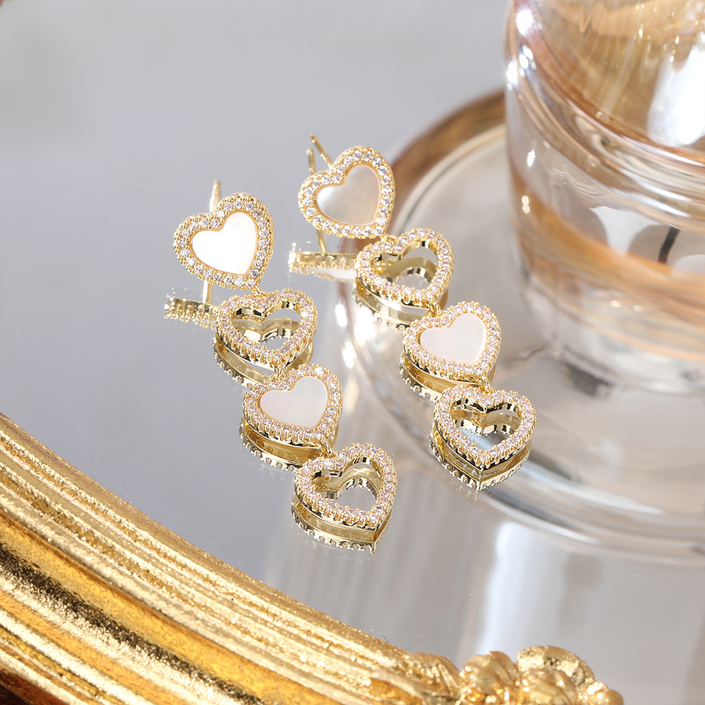 S925 Silver Needle Light Luxury Micro-inlaid zircon heart-shaped earrings are versatile, fashionable, elegant and high-end, and are a new type of anti-allergy earrings pic 5