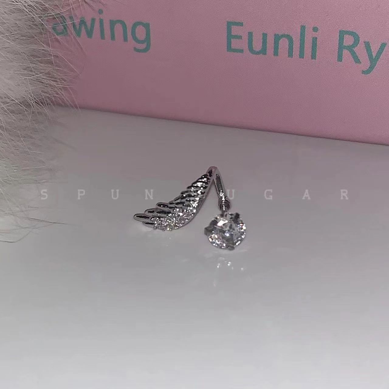 Stunning angel wing ear bone stud titanium steel versatile, unique and niche angel wing entwined sparkling diamond ear stud earrings for women pic 5