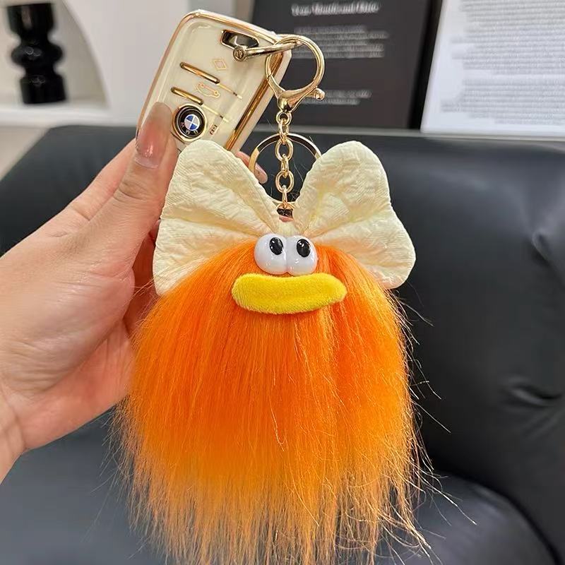 可爱蝴蝶结怪兽娃娃钥匙扣卡通搞怪毛绒书包挂件丑萌玩偶挂饰礼品详情11