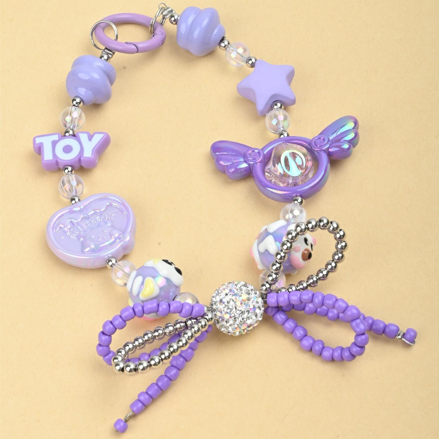 Wholesale of irregular handcrafted beaded diamond balls, double-layer bow ties, mobile phone chains, keys, bags and pendants in the Japanese and Korean ins style pic 1