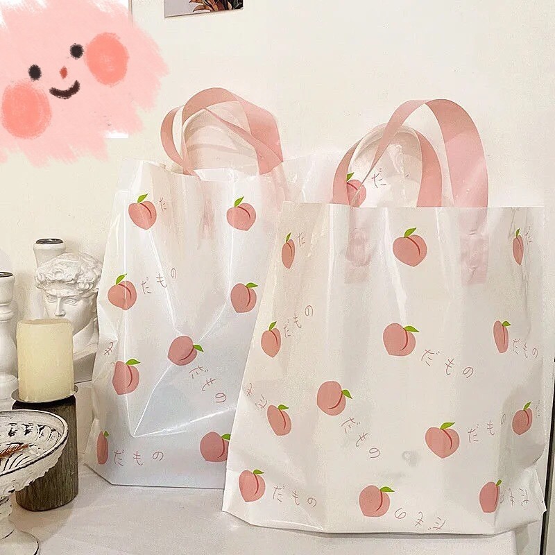 服装店袋子手提塑料袋夏日水蜜桃清新诱惑塑料购物袋化妆品袋包邮详情3