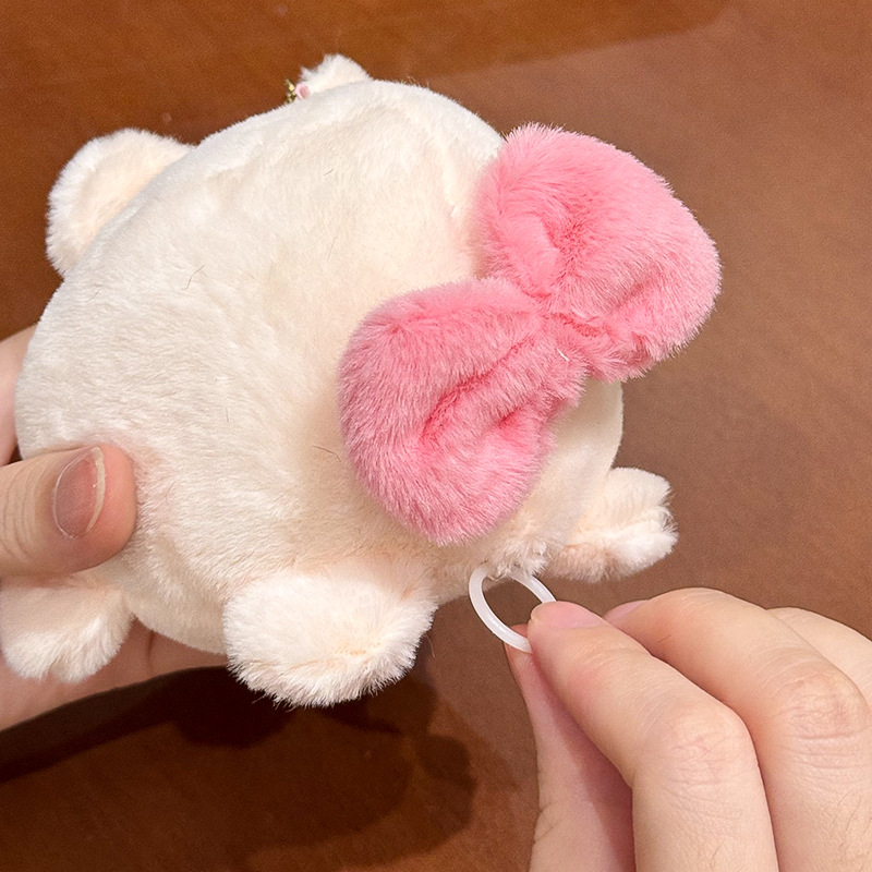 The little cat doll that wags its tail by pulling a rope is called the popular little white rabbit plush toy backpack doll at the street stall pic 6