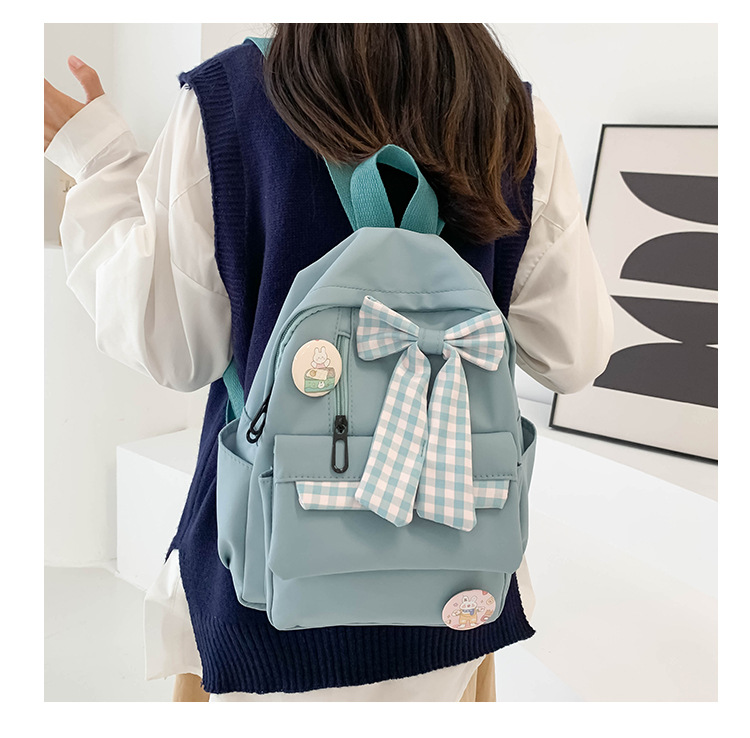 蝴蝶结书包女小学生大容量三到六年级初中轻便减负可爱简约双肩包详情4