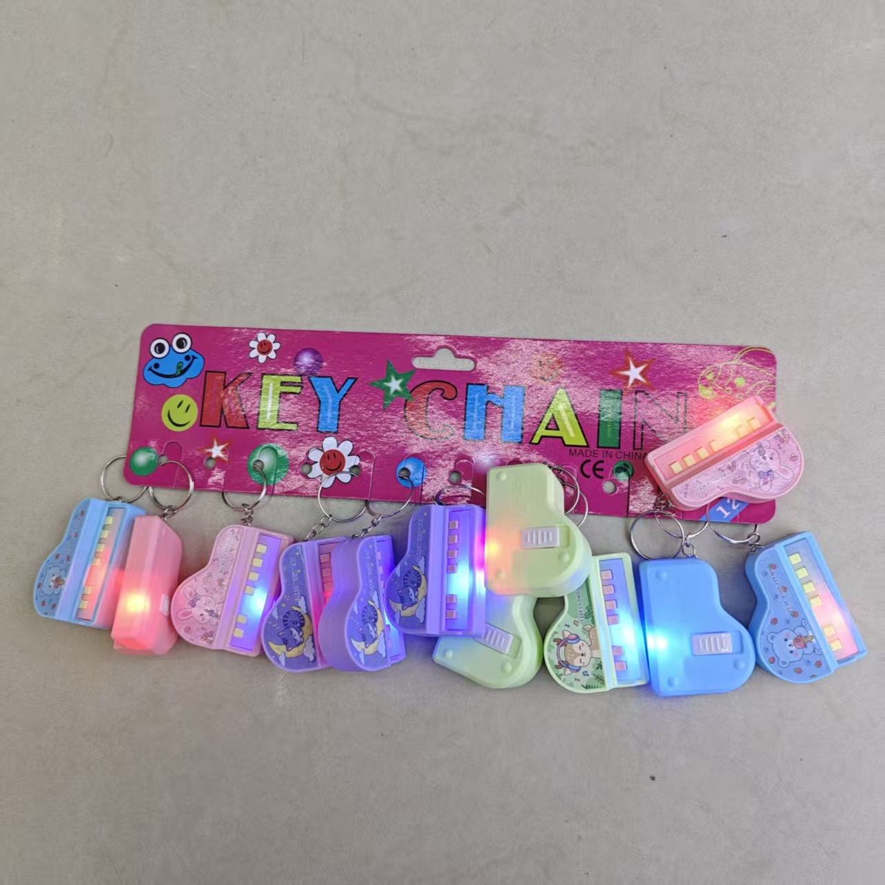 New light-emitting toy cross-border mini flashing piano keychain pendant, cute cartoon keychain gift wholesale pic 1