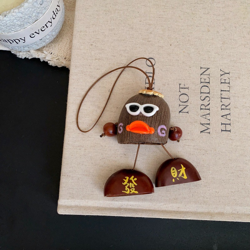 The natural cartoon pendant with the shell of the water bell tree, a soothing sound therapy seed, is a popular and cute pendant accessory in the scenic area pic 5