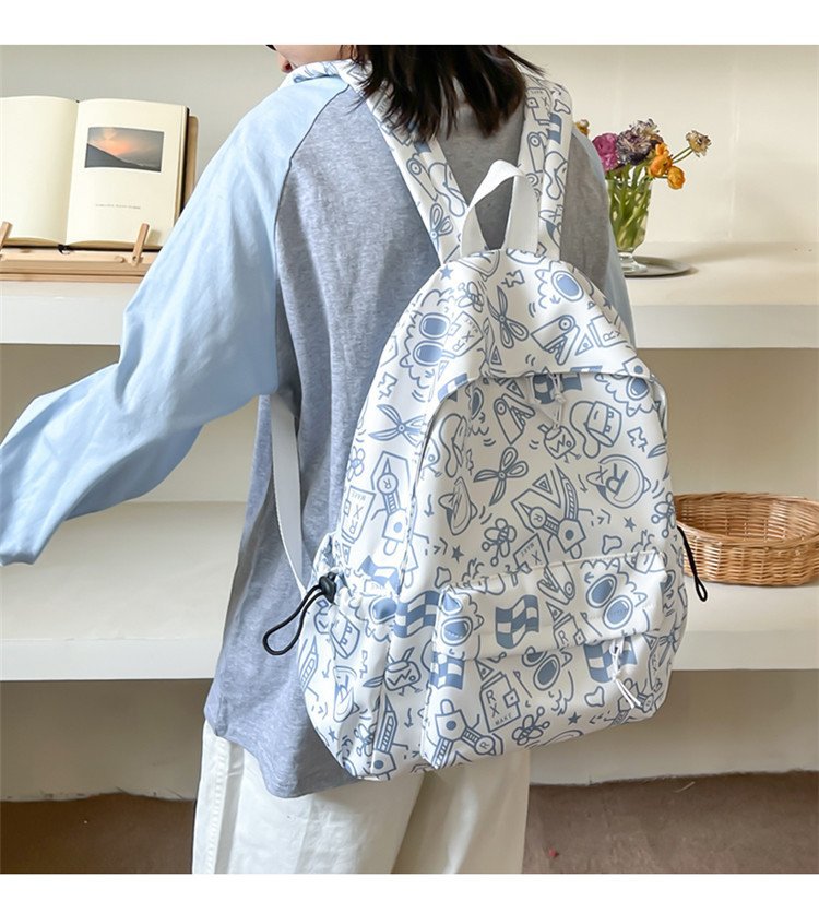 双肩包女时尚简约印花初高中大学生书包韩版潮流涂鸦休闲双肩背包详情18