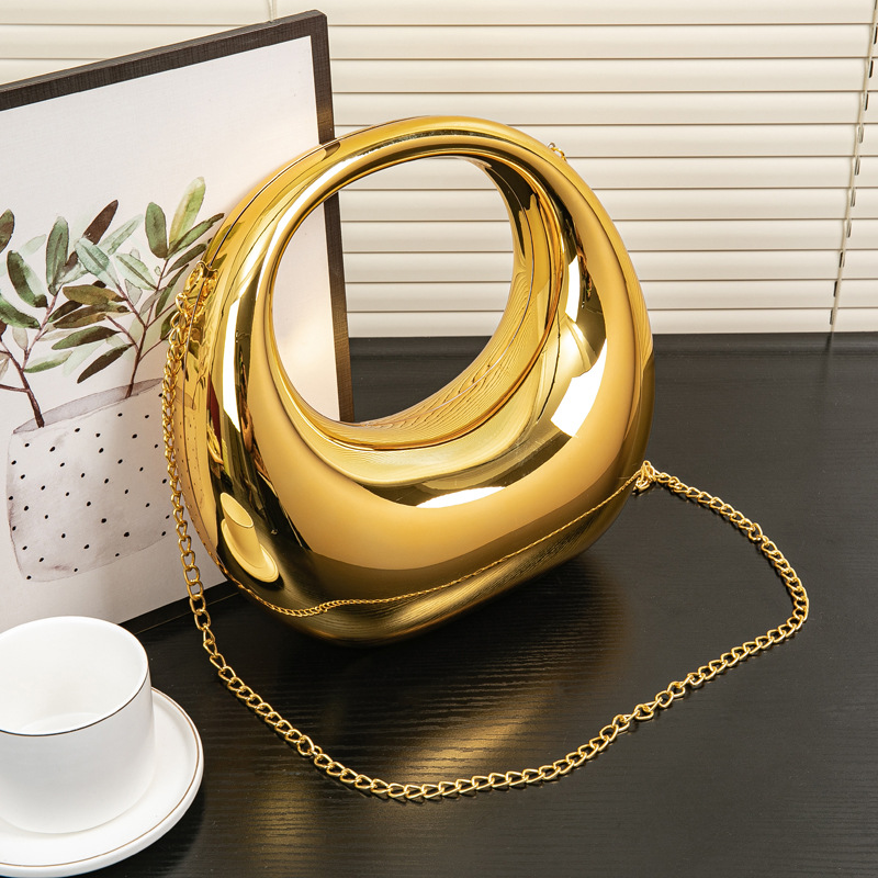 2024春夏欧美爆款跨境弯月包金银晚宴包手提包化妆亚克力包详情3