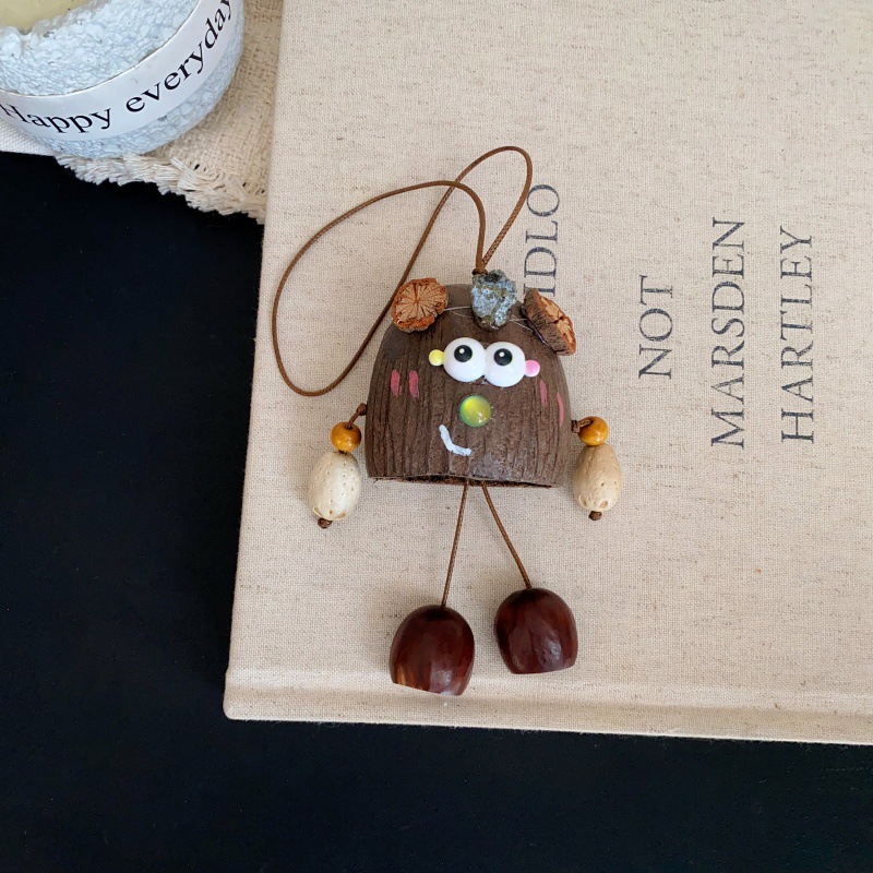 The natural cartoon pendant with the shell of the water bell tree, a soothing sound therapy seed, is a popular and cute pendant accessory in the scenic area pic 6