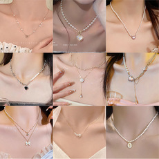 Korean retro titanium steel necklace for women, versatile and high-end pearl pendant, ins style niche collarbone chain accessory wholesale pic 4