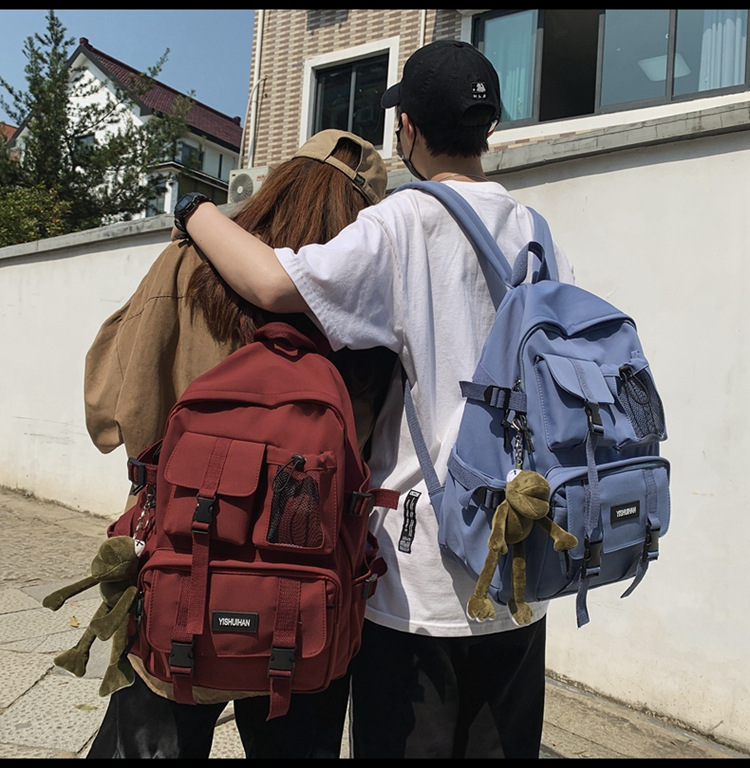 休闲百搭男女双肩包可爱挂件洋气潮流学生书包大容量工装风背包详情5