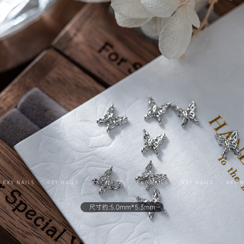 The alloy butterfly bow tie series of nail art accessories is a popular three-dimensional bestseller. It is a high-end and light luxury nail accessory with a butterfly diamond pattern pic 3