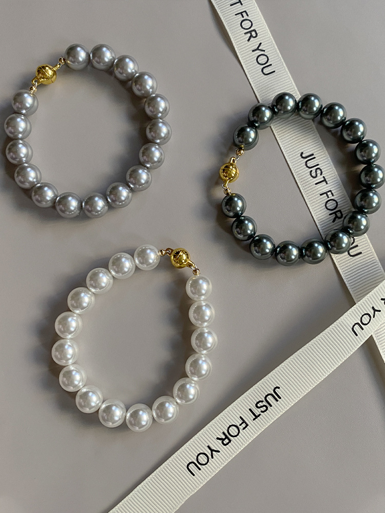 This is a trendy accessory for women, featuring a strong Australian white round magnetic pearl bracelet. It exudes a light luxury, niche and high-end vibe pic 11