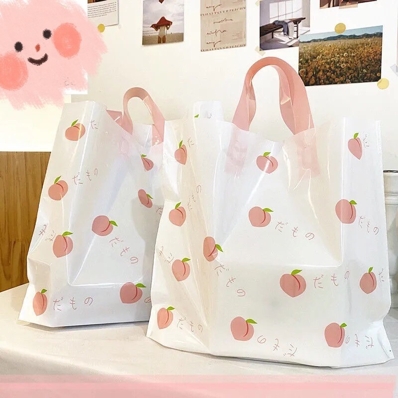 服装店袋子手提塑料袋夏日水蜜桃清新诱惑塑料购物袋化妆品袋包邮详情2