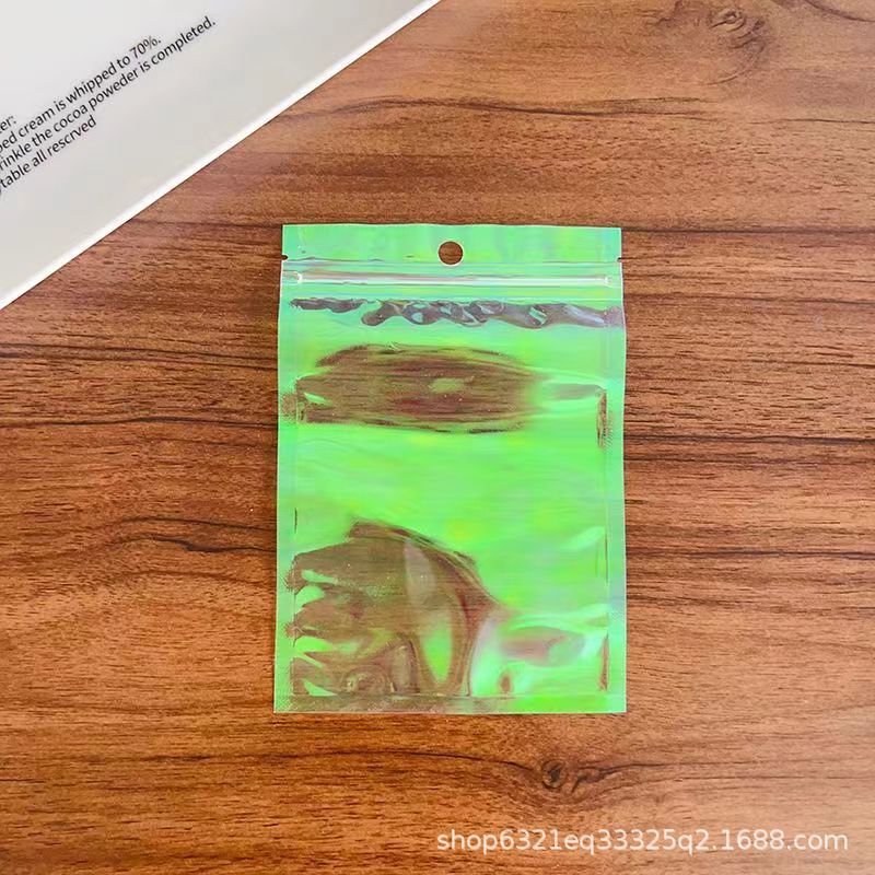 Yiwu Laser Phantom Color self-standing and Self-sealing bags, Yin-Yang aluminum foil bags, mobile phone cases, beauty and accessory packaging bags wholesale pic 12