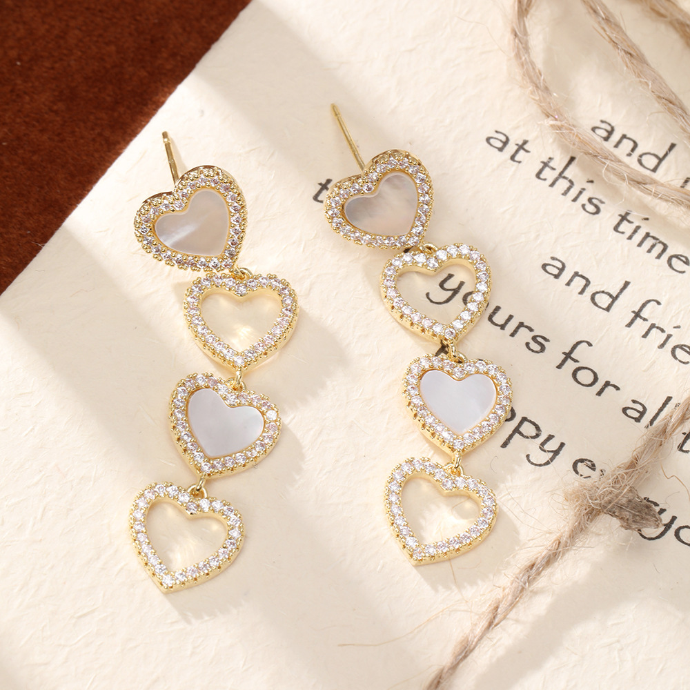 S925 Silver Needle Light Luxury Micro-inlaid zircon heart-shaped earrings are versatile, fashionable, elegant and high-end, and are a new type of anti-allergy earrings pic 4