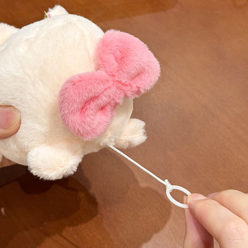 The little cat doll that wags its tail by pulling a rope is called the popular little white rabbit plush toy backpack doll at the street stall pic 7