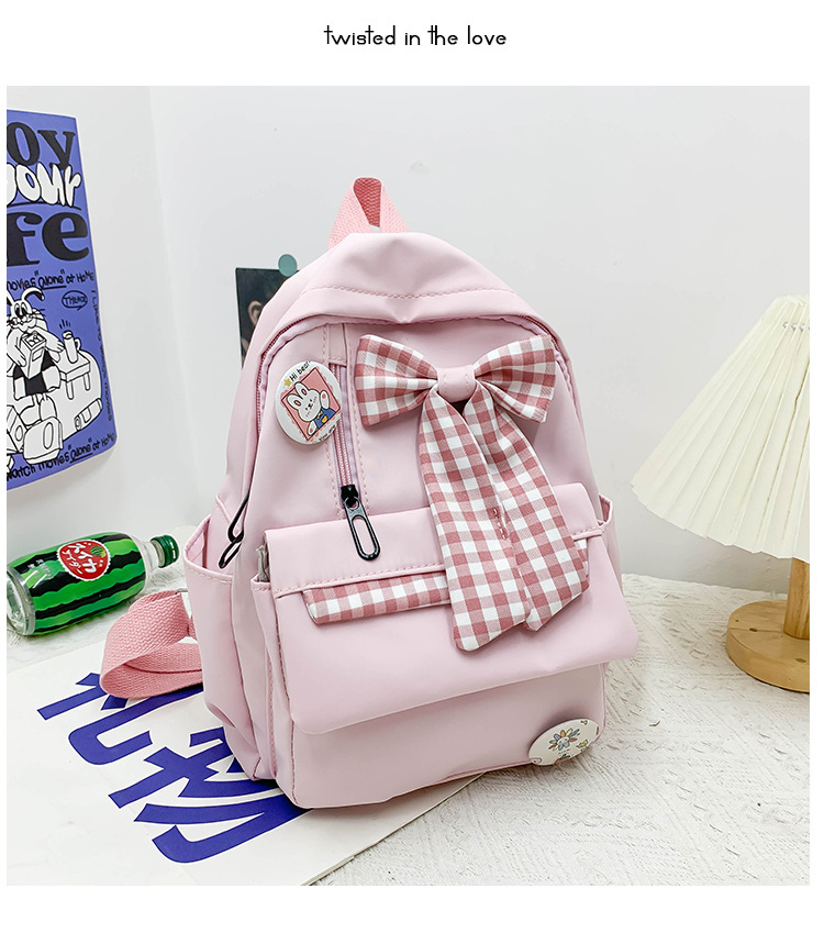 蝴蝶结书包女小学生大容量三到六年级初中轻便减负可爱简约双肩包详情19