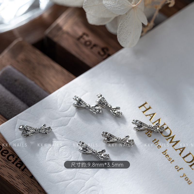 The alloy butterfly bow tie series of nail art accessories is a popular three-dimensional bestseller. It is a high-end and light luxury nail accessory with a butterfly diamond pattern pic 6