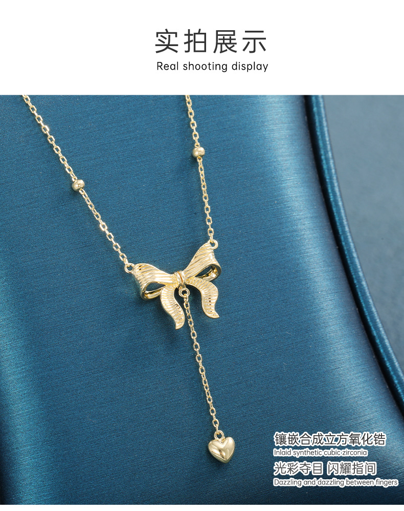 影响力饰品跨境在逃公主黄金色蝴蝶结项链长款毛衣链爱心吊坠流苏锁骨链女详情8