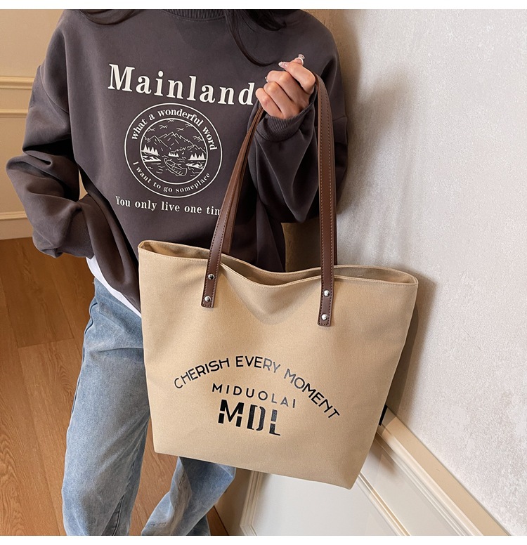 Large-capacity 2025 new style simple single-shoulder hand-carry cloth bag, college student class tote bag, versatile canvas bag for women pic 10