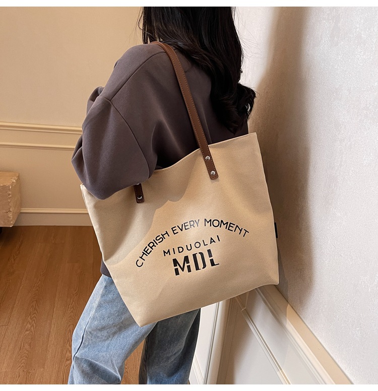 Large-capacity 2025 new style simple single-shoulder hand-carry cloth bag, college student class tote bag, versatile canvas bag for women pic 5