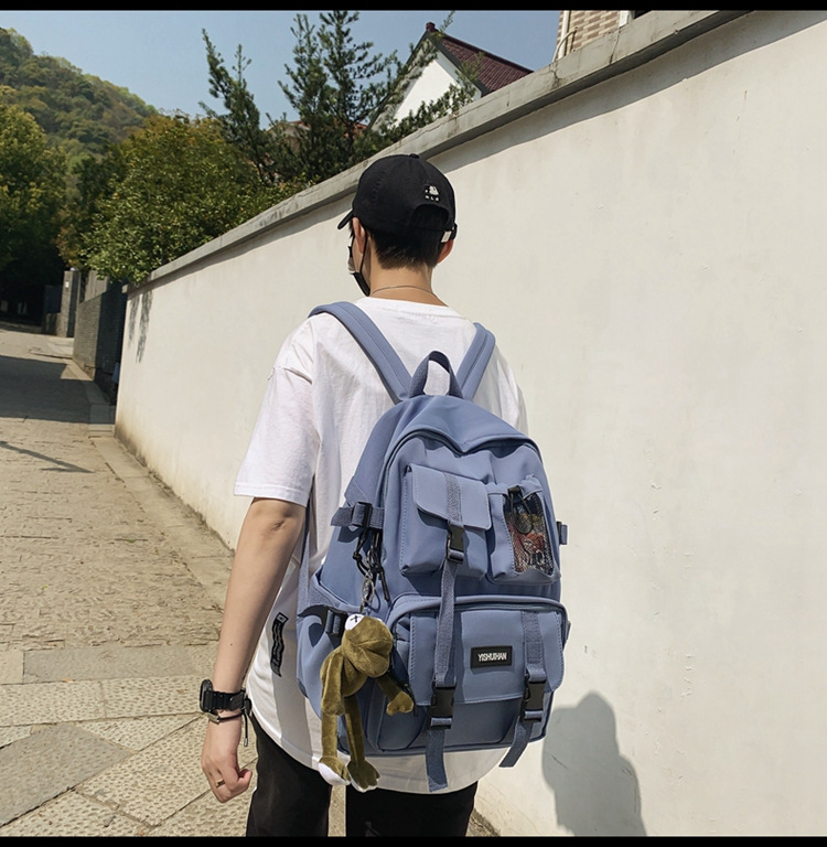 休闲百搭男女双肩包可爱挂件洋气潮流学生书包大容量工装风背包详情15