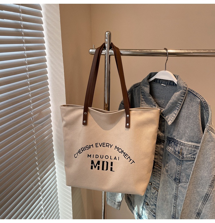 Large-capacity 2025 new style simple single-shoulder hand-carry cloth bag, college student class tote bag, versatile canvas bag for women pic 3