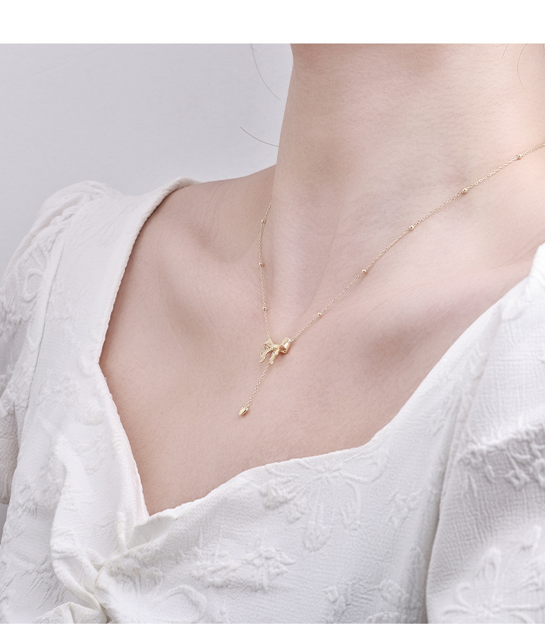 影响力饰品跨境在逃公主黄金色蝴蝶结项链长款毛衣链爱心吊坠流苏锁骨链女详情4