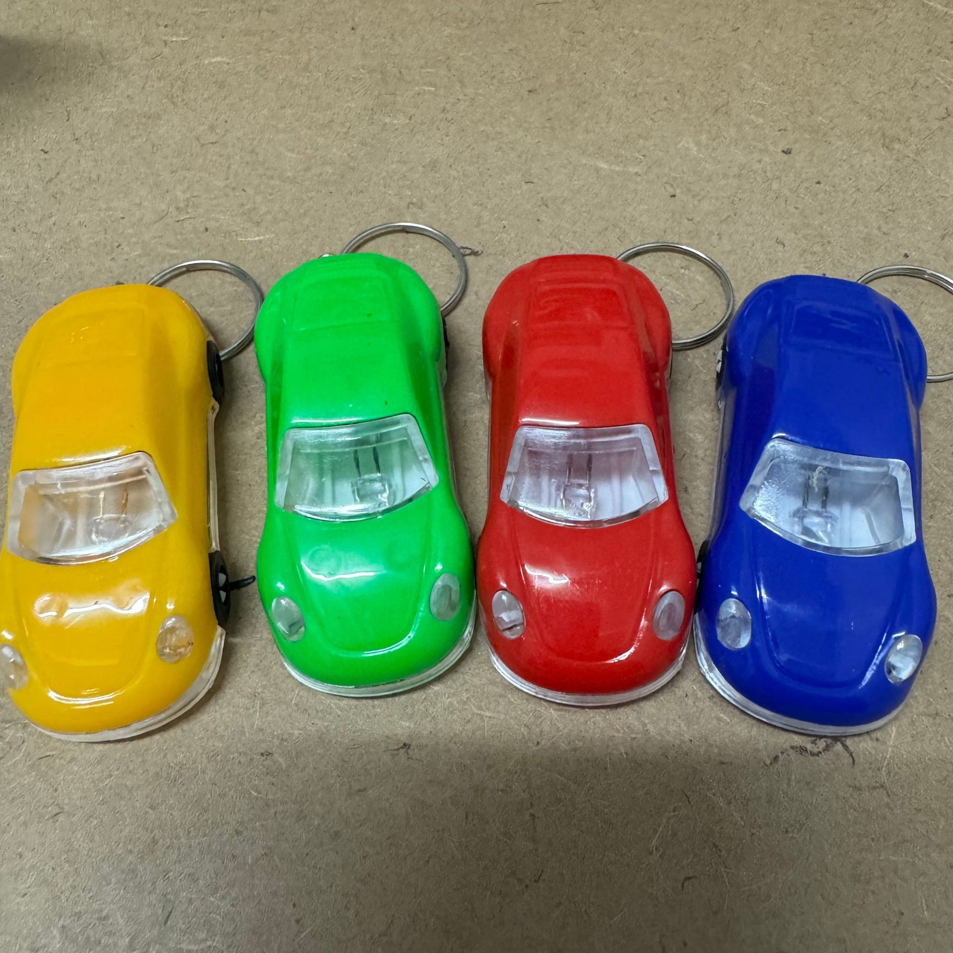 Wholesale of luminous toy car keychains, student bag pendants, fashionable car key pendants, sports car small gifts pic 1