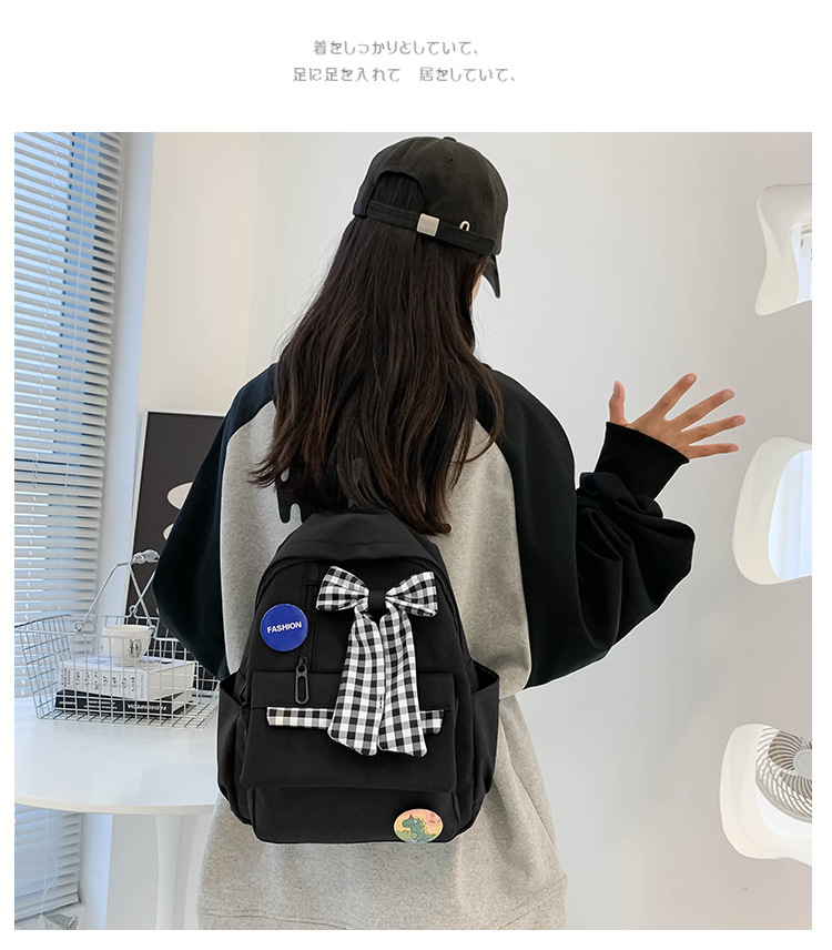 蝴蝶结书包女小学生大容量三到六年级初中轻便减负可爱简约双肩包详情5