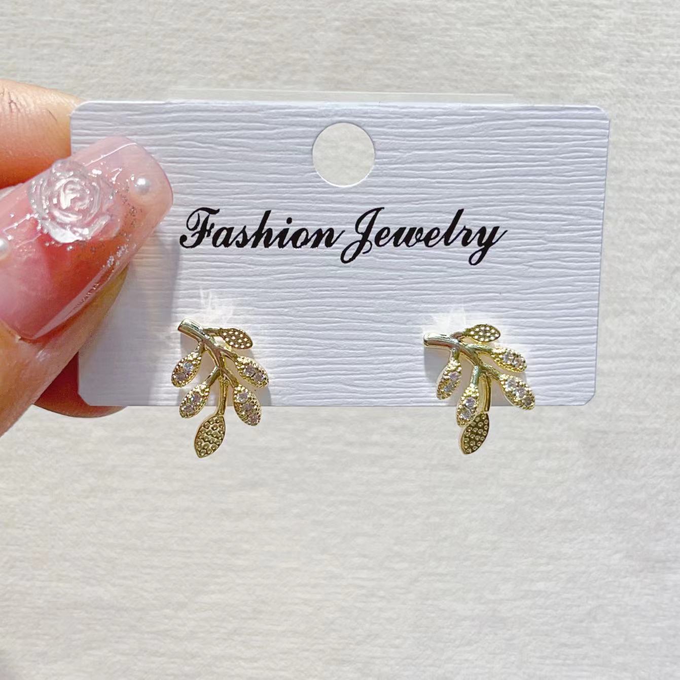 The trendy, light luxury, fresh smiley face, leaf, copper plated with real gold and slightly inlaid zircon, light luxury, niche design of INS ear studs pic 3