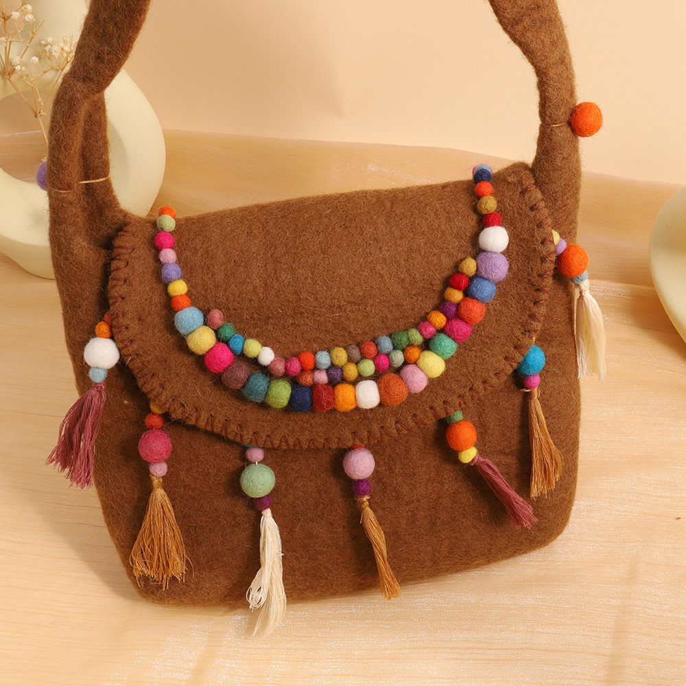 民族风羊毛毡挎包尼泊尔手工羊毛毡包包精致羊毛毡手拿包厂家直销详情8