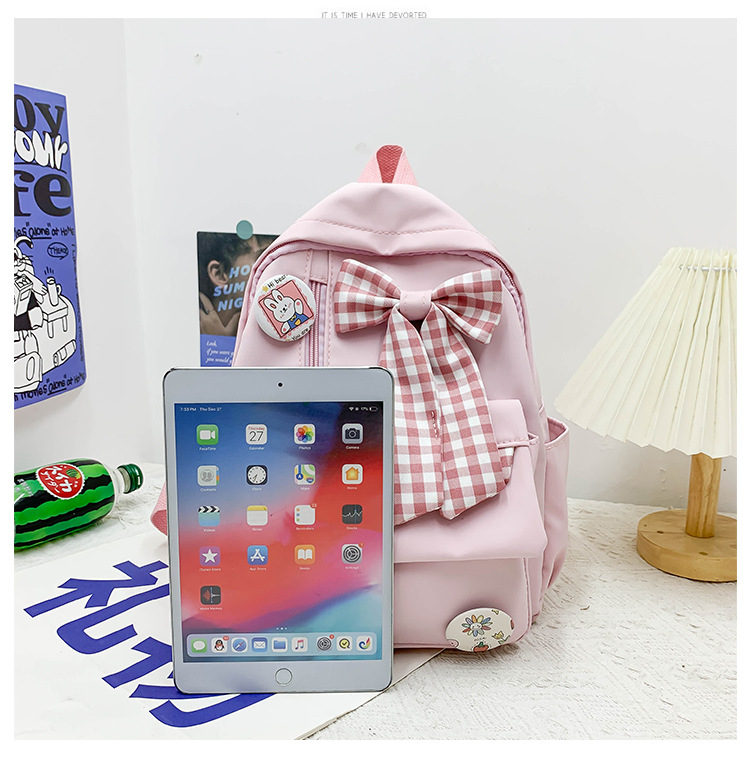 蝴蝶结书包女小学生大容量三到六年级初中轻便减负可爱简约双肩包详情23