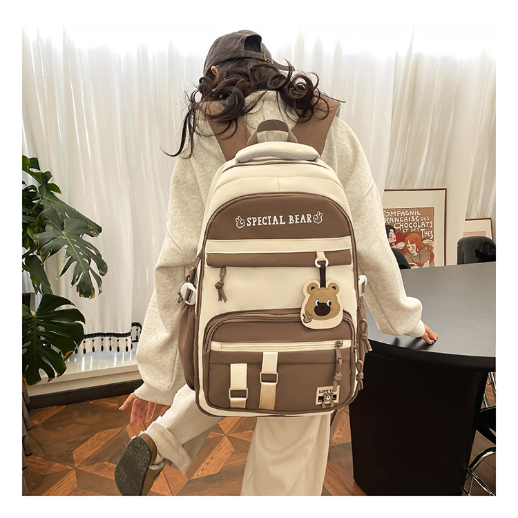 批发新款初高中学生大容量书包轻便减负背包小学生简约结实双肩包详情7