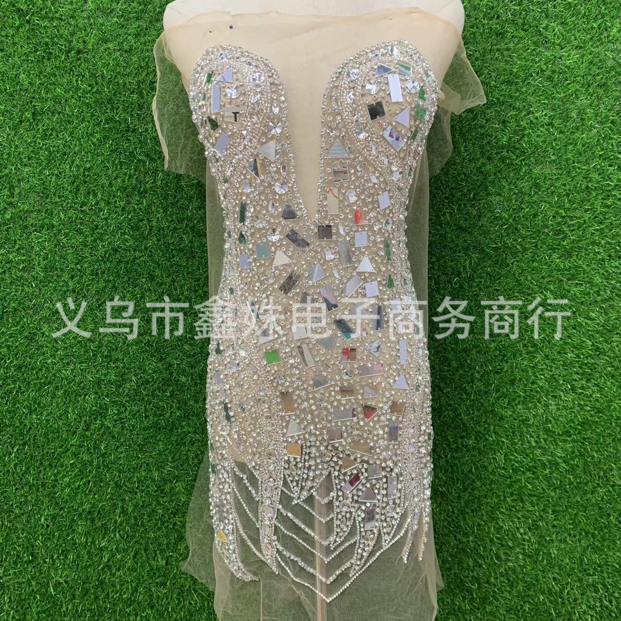 The new deep V wedding dress features heavy handcrafted mirror stitching, beaded mesh and applique pic 5