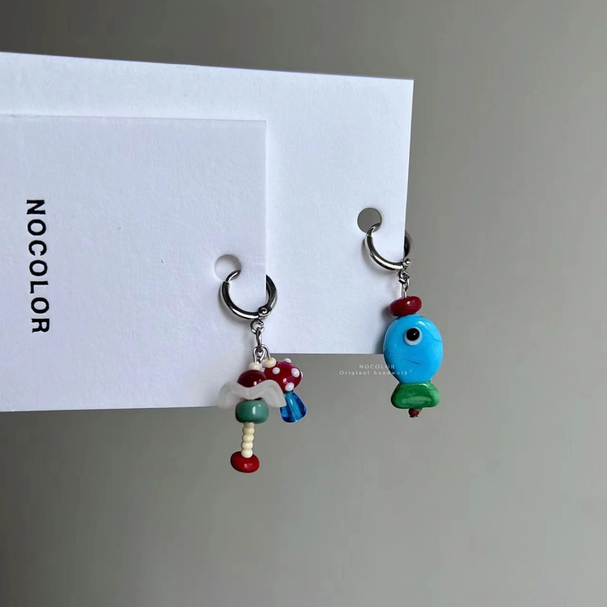 The new Chinese-style retro beaded asymmetrical small fish flower ear buckle design is elegant, unique, simple and distinctive for women pic 2