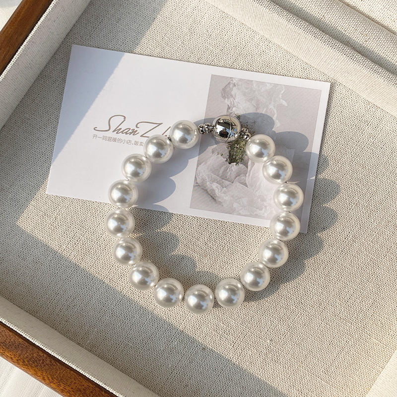 This is a trendy accessory for women, featuring a strong Australian white round magnetic pearl bracelet. It exudes a light luxury, niche and high-end vibe pic 36