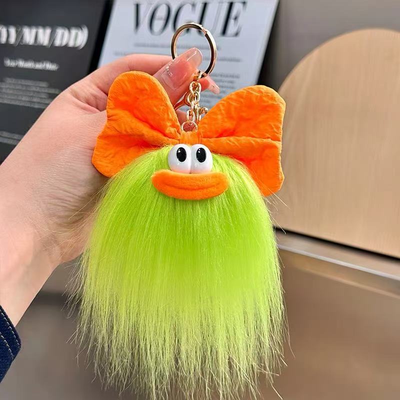可爱蝴蝶结怪兽娃娃钥匙扣卡通搞怪毛绒书包挂件丑萌玩偶挂饰礼品详情7