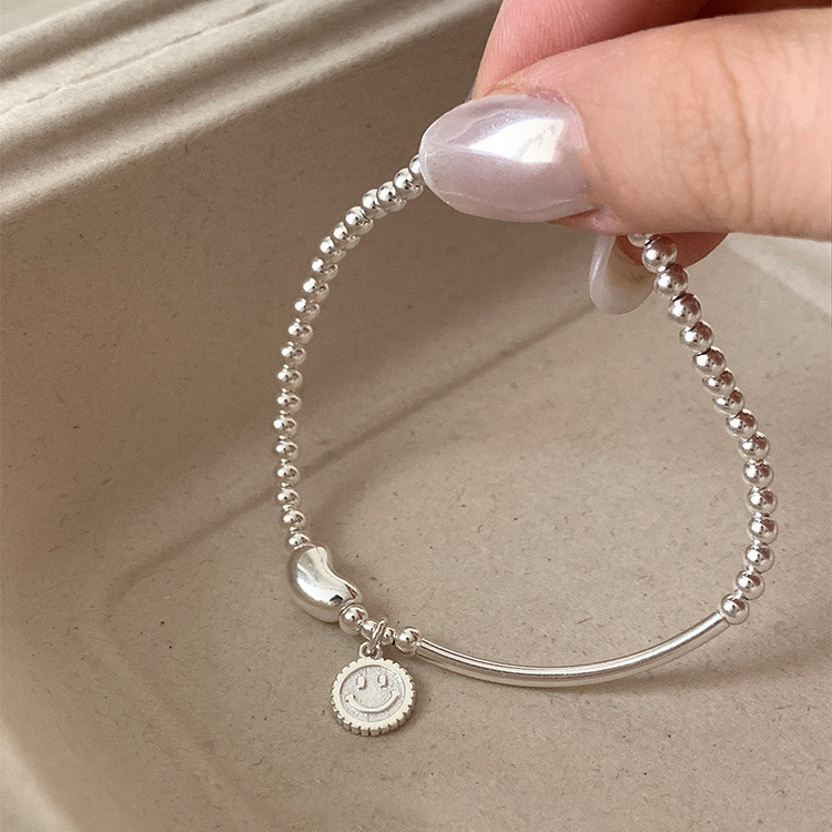 S925 sterling silver smiley face bean elastic beaded bracelet: simple and versatile, light luxury, ins niche jewelry with a sense of sophistication pic 3