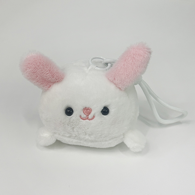 The little cat doll that wags its tail by pulling a rope is called the popular little white rabbit plush toy backpack doll at the street stall pic 15
