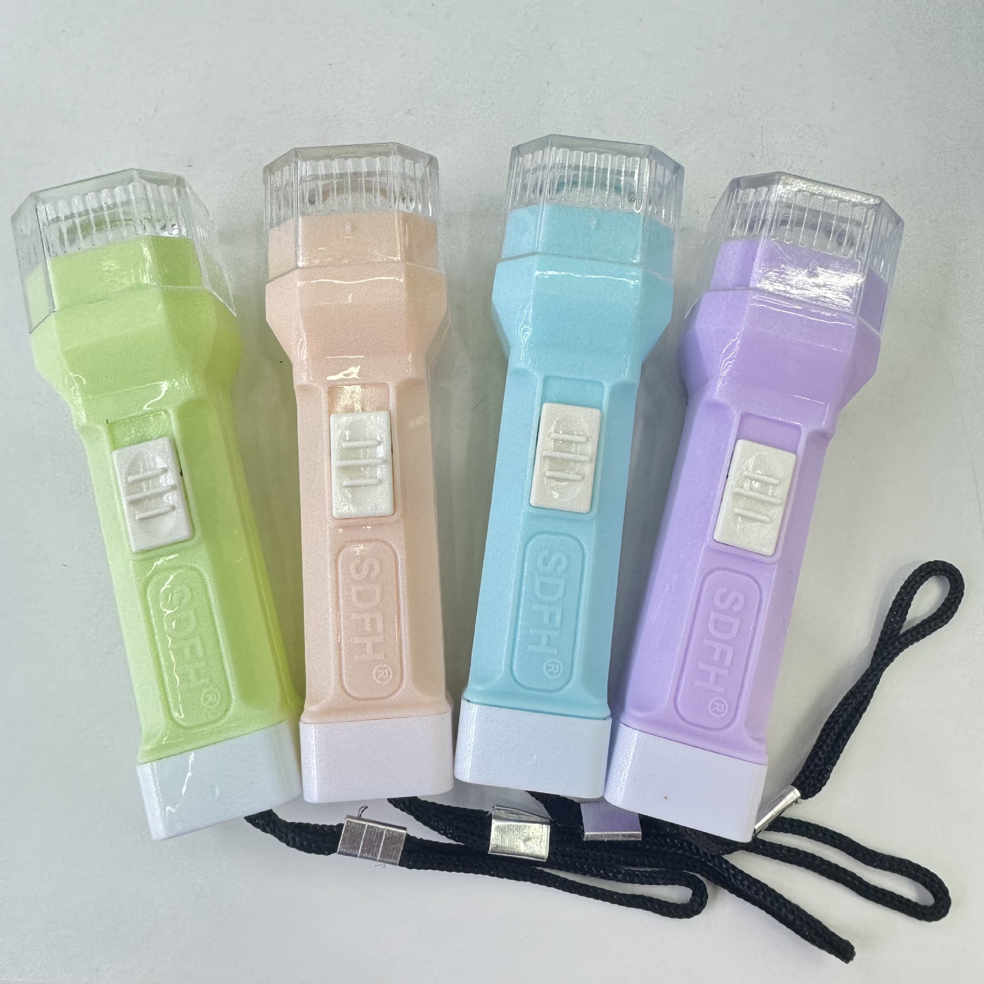 Wholesale of various styles of flashlights, colored plastic outdoor household hand-held white light illumination portable keychain flashlights pic 1