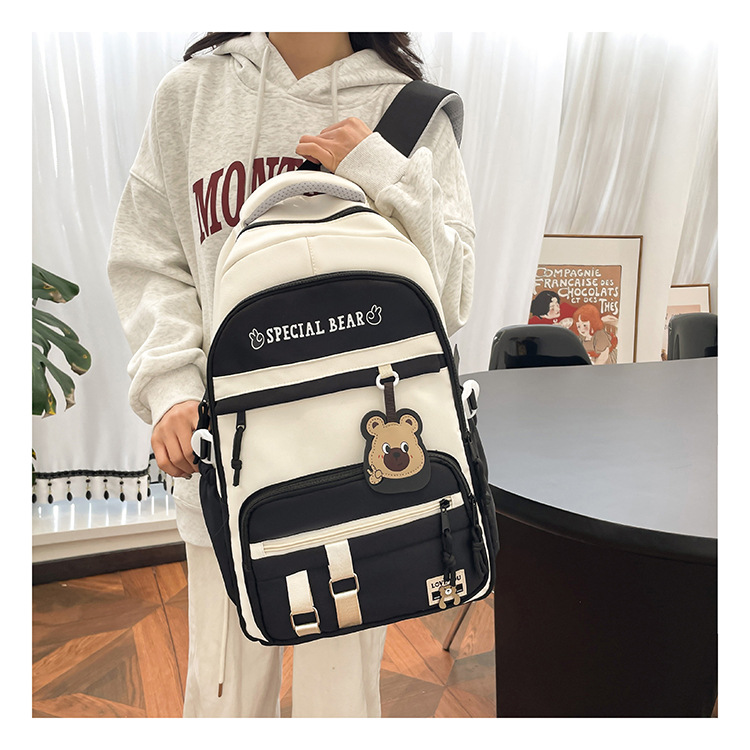 批发新款初高中学生大容量书包轻便减负背包小学生简约结实双肩包详情10